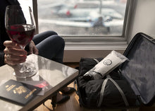 Load image into Gallery viewer, lifestyle image showing a jet bag in use in a suitcase at the airport