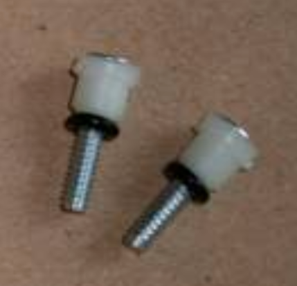 close up of kidswitch replacement screws with grommets